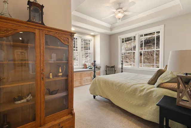 a bedroom with a bed and chair