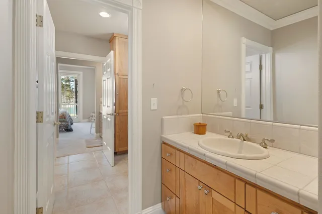 a en suite bathroom with a sink and a mirror