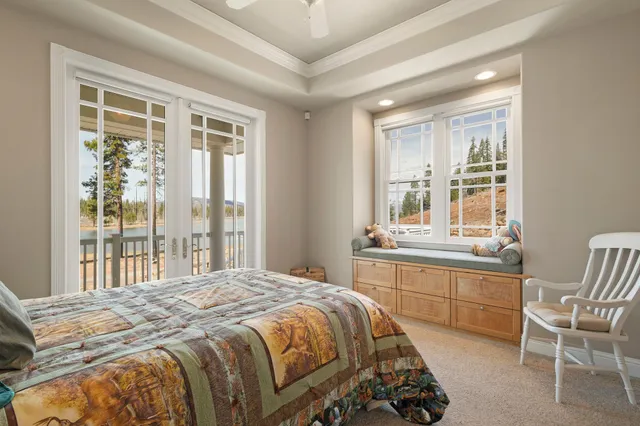 a living room with furniture a flat screen tv and a window