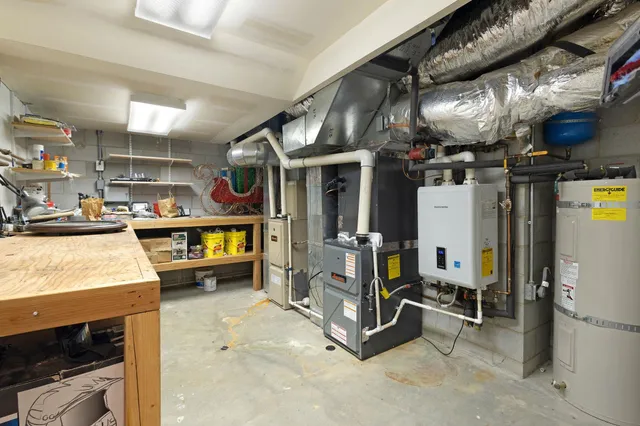 a room with furniture a air conditioner and a window