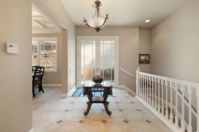 a kitchen with a sink refrigerator and cabinets