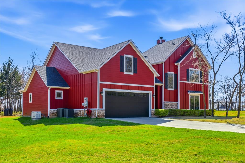 216 Glen Ellen Road Pottsboro, TX 75076 - Photo 1 of 38 a view of a house with a yard