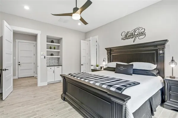 a living room with a bed and a table