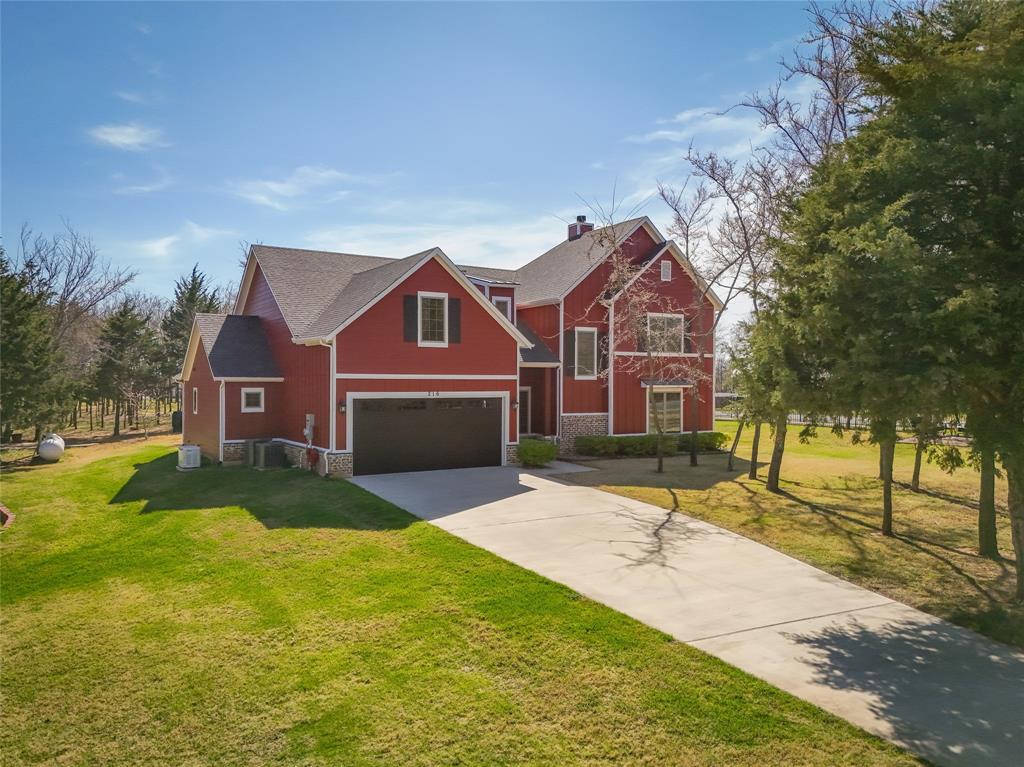 216 Glen Ellen Road Pottsboro, TX 75076 - Photo 38 of 38 a house view with a garden space