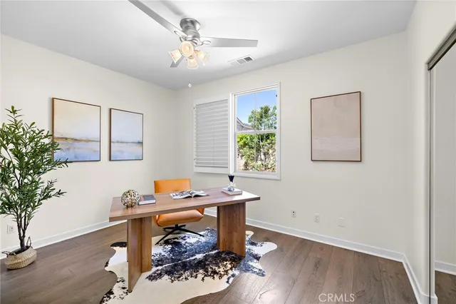 a workspace with furniture and window