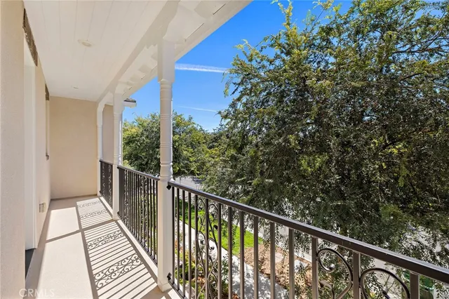 a view of a balcony with wooden floor