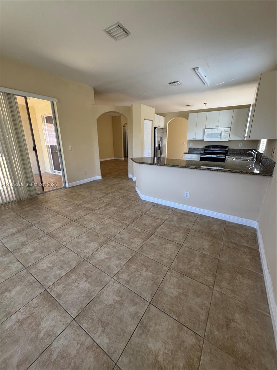 12860 Southwest 51st Street Miramar, FL 33027 - Photo 11 of 29 a view of a kitchen with a sink