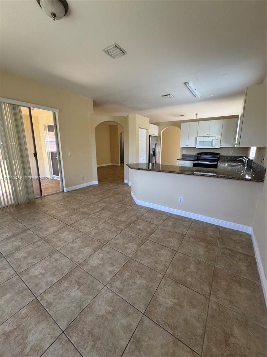 12860 Southwest 51st Street Miramar, FL 33027 - Photo 12 of 29 a view of a livingroom with furniture
