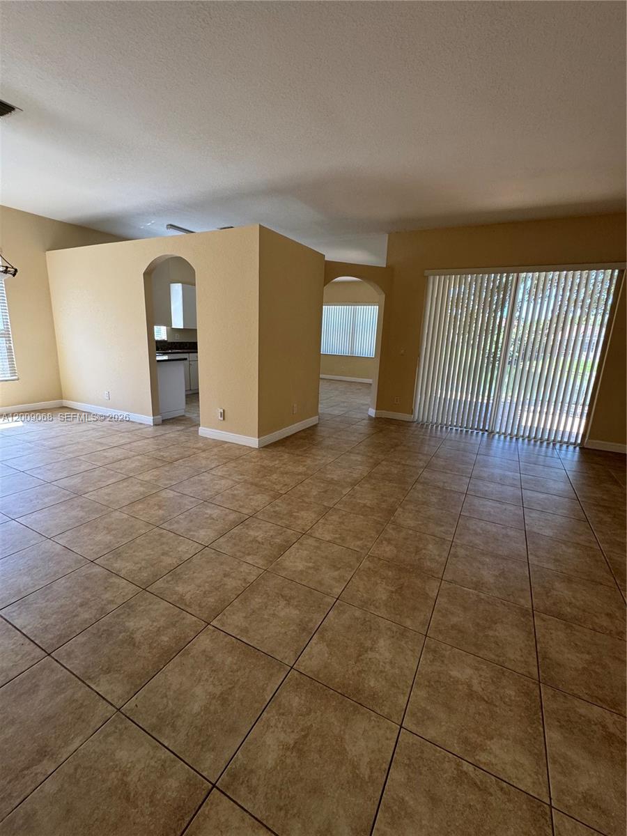 12860 Southwest 51st Street Miramar, FL 33027 - Photo 15 of 29 a view of a livingroom with a staircase