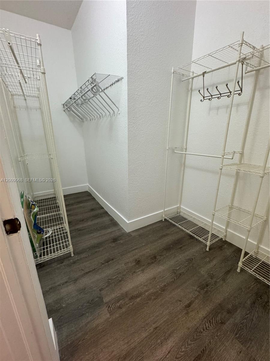 12860 Southwest 51st Street Miramar, FL 33027 - Photo 20 of 29 a view of a room with racks on the wall