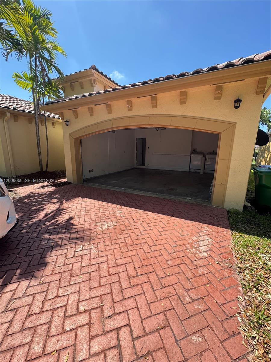 12860 Southwest 51st Street Miramar, FL 33027 - Photo 3 of 29 a view of a backyard of the house
