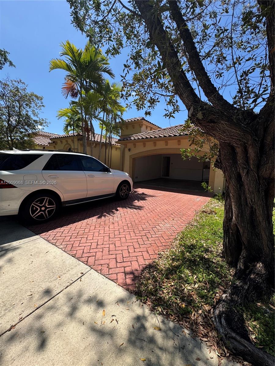 12860 Southwest 51st Street Miramar, FL 33027 - Photo 5 of 29 a view of outdoor space with garden