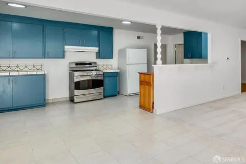 a kitchen with a cabinets and a stove
