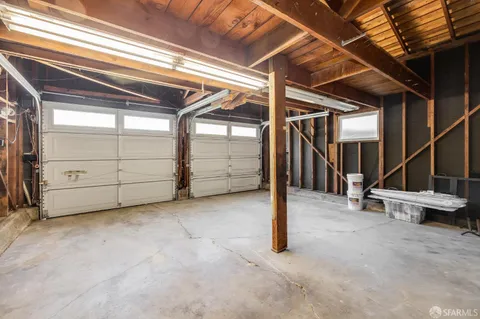 a view of an empty room with stairs