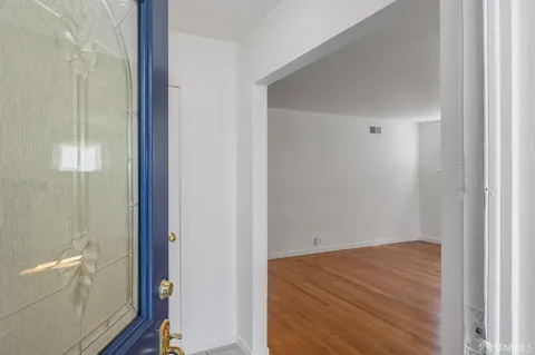 a view of a bathroom from a hallway