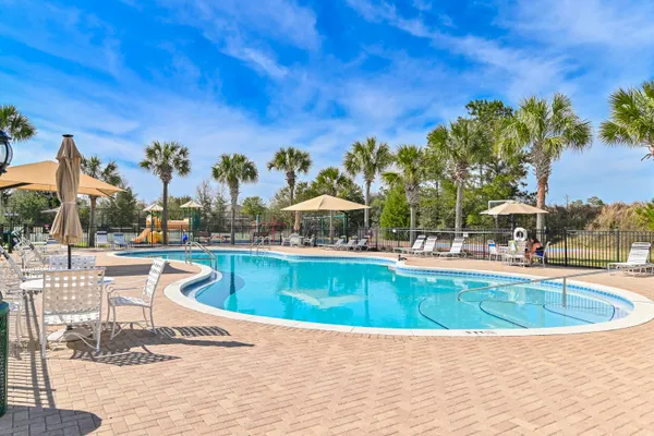 a view of a swimming pool with a patio