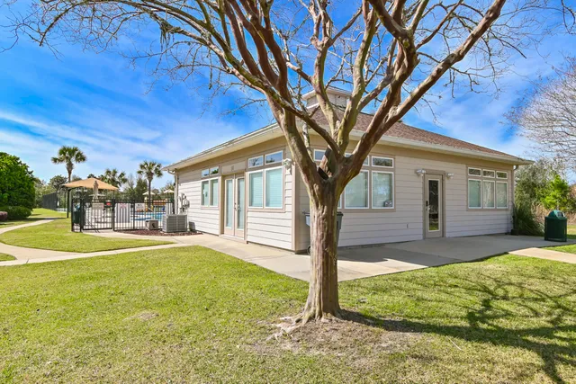 swimming pool view with a garden space