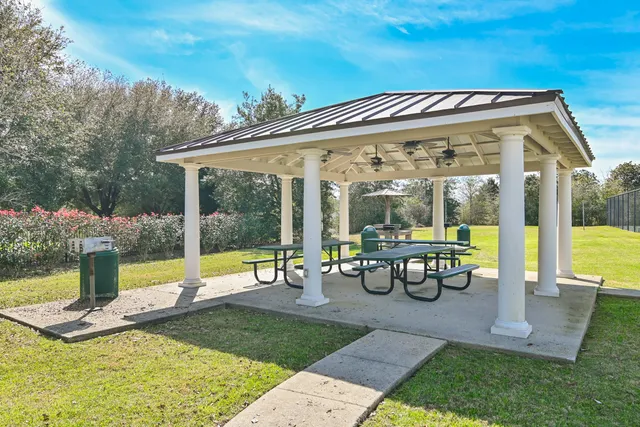 a swimming pool with outdoor seating
