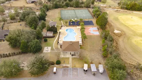 an aerial view of a house with a yard