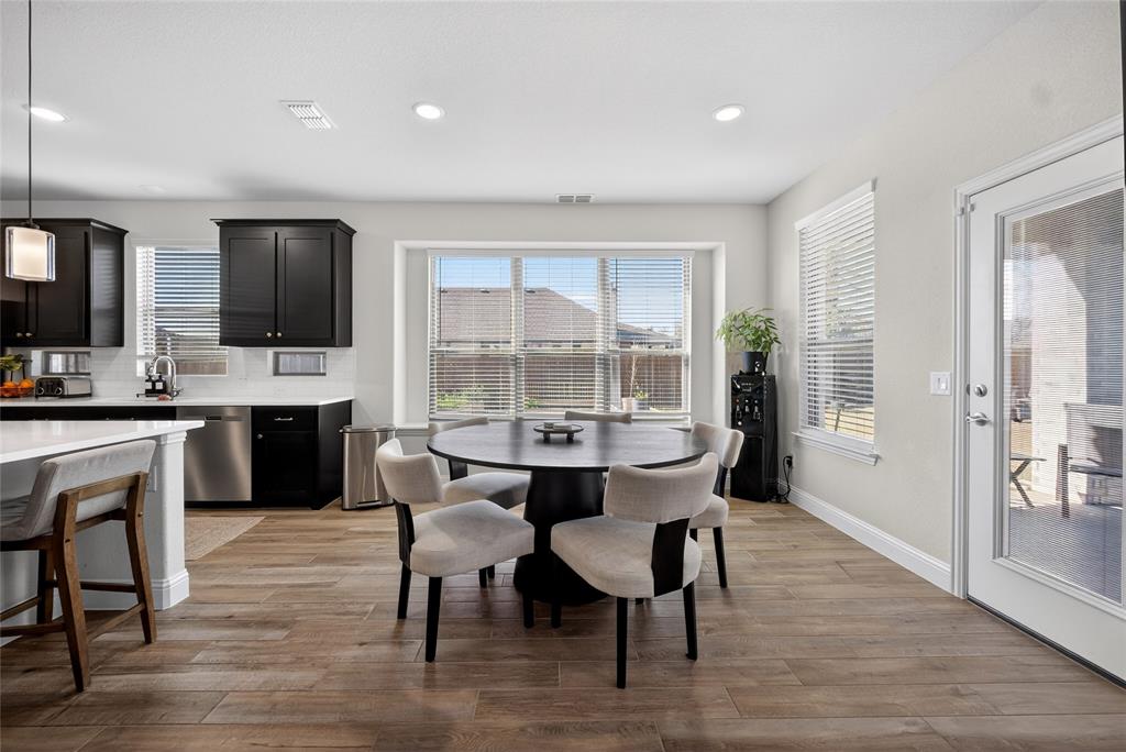 596 Randys Way Pilot Point, TX 76258 - Photo 17 of 40 a view of a dining room with furniture window and wooden floor