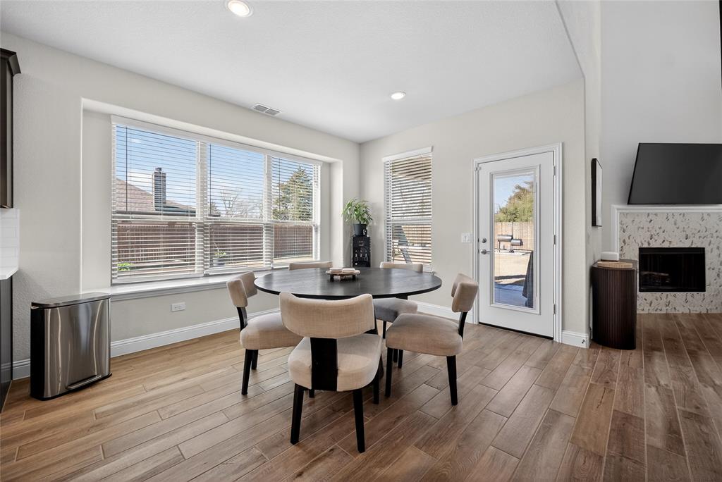 596 Randys Way Pilot Point, TX 76258 - Photo 18 of 40 a view of a dining room with furniture window and wooden floor