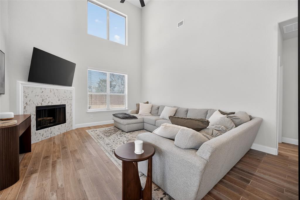596 Randys Way Pilot Point, TX 76258 - Photo 19 of 40 a living room with furniture and a fireplace