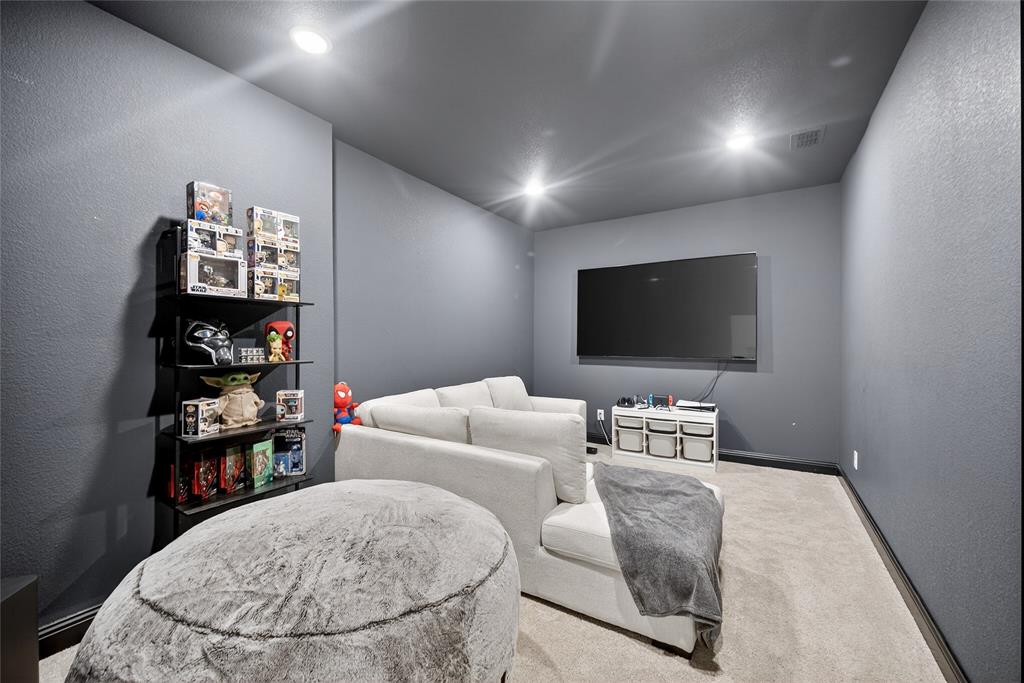 596 Randys Way Pilot Point, TX 76258 - Photo 28 of 40 a living room with furniture and a flat screen tv