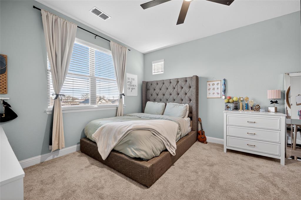 596 Randys Way Pilot Point, TX 76258 - Photo 29 of 40 a bedroom with a bed and window