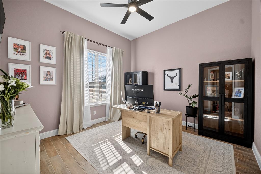 596 Randys Way Pilot Point, TX 76258 - Photo 5 of 40 a room with furniture a flat screen tv and a window