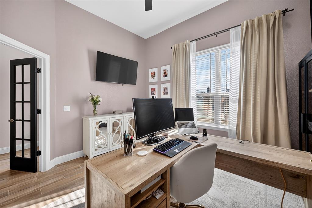 596 Randys Way Pilot Point, TX 76258 - Photo 6 of 40 a living room with a flat screen tv and a window