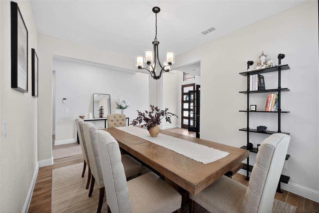 596 Randys Way Pilot Point, TX 76258 - Photo 10 of 40 a view of a dining room with furniture and wooden floor