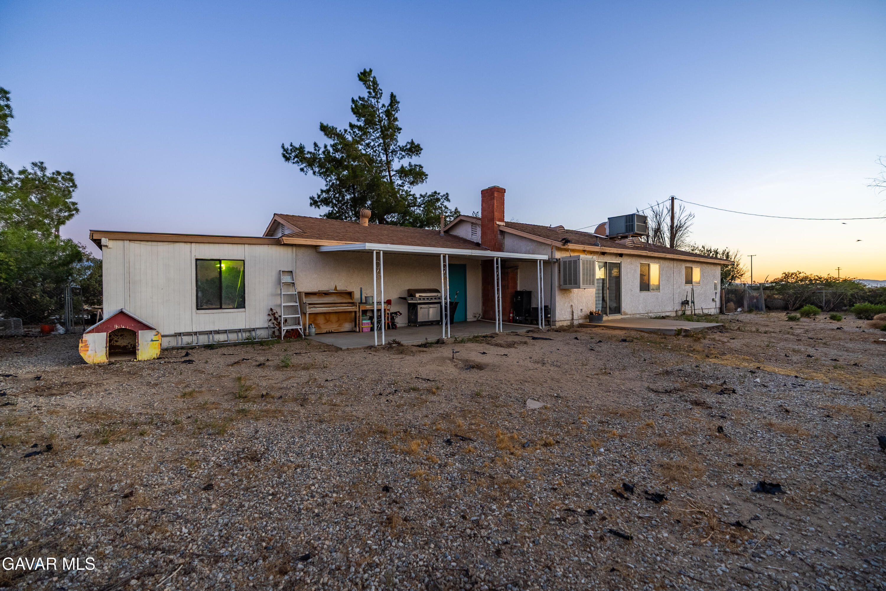 20539 East Ave R Palmdale, CA 93591 - Photo 35 of 55 a view of a house with backyard