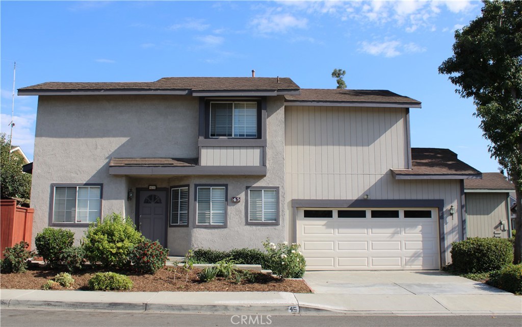 45 Bridgeport Irvine, CA 92620 - Photo 1 of 20 a front view of a house with a garden
