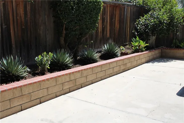 a view of a bench in the backyard