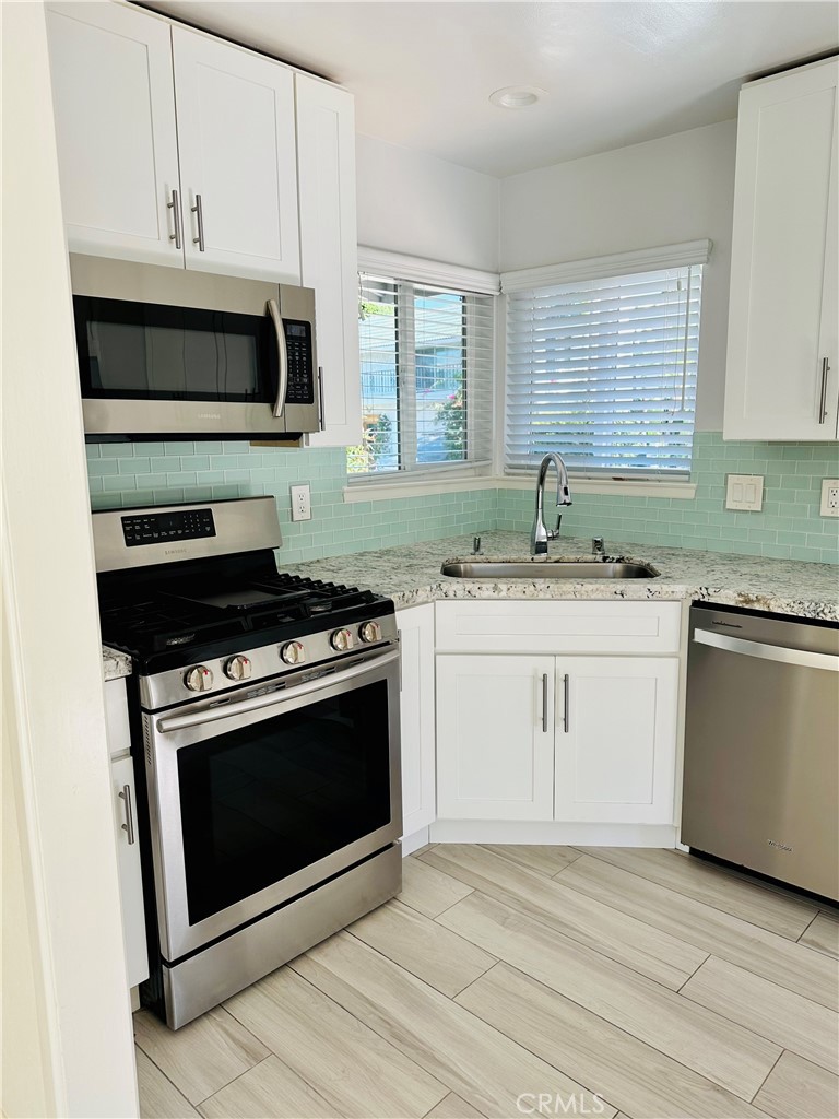 34095 Aurelio Dana Point, CA 92629 - Photo 13 of 32 a kitchen with a stove and a sink