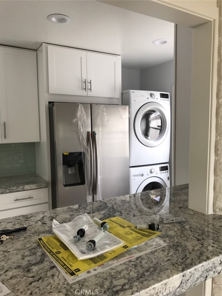 34095 Aurelio Dana Point, CA 92629 - Photo 15 of 32 a bathroom with a sink a washer and dryer