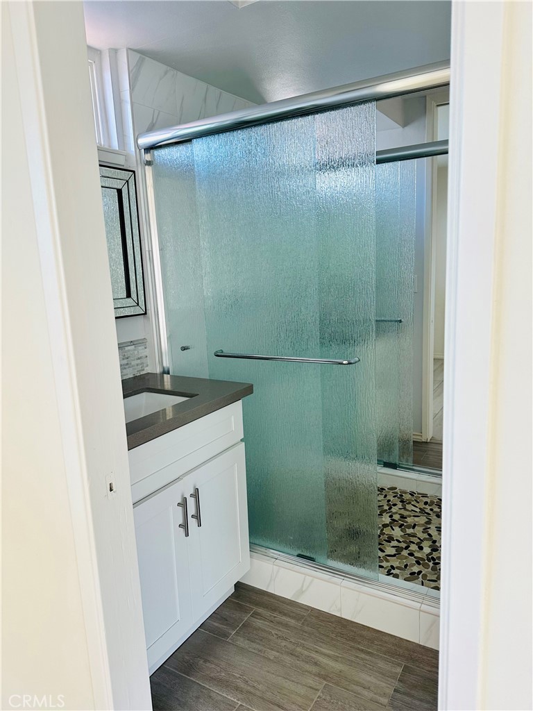 34095 Aurelio Dana Point, CA 92629 - Photo 19 of 32 a bathroom with a shower and a sink