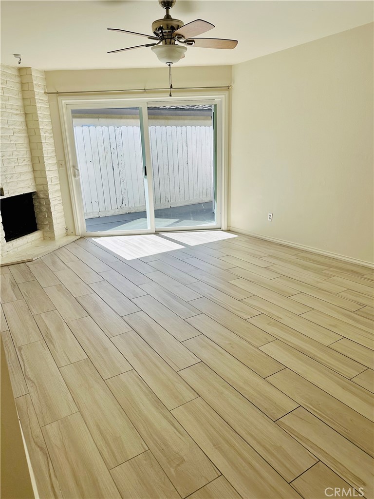 34095 Aurelio Dana Point, CA 92629 - Photo 6 of 32 an empty room with wooden floor and fan