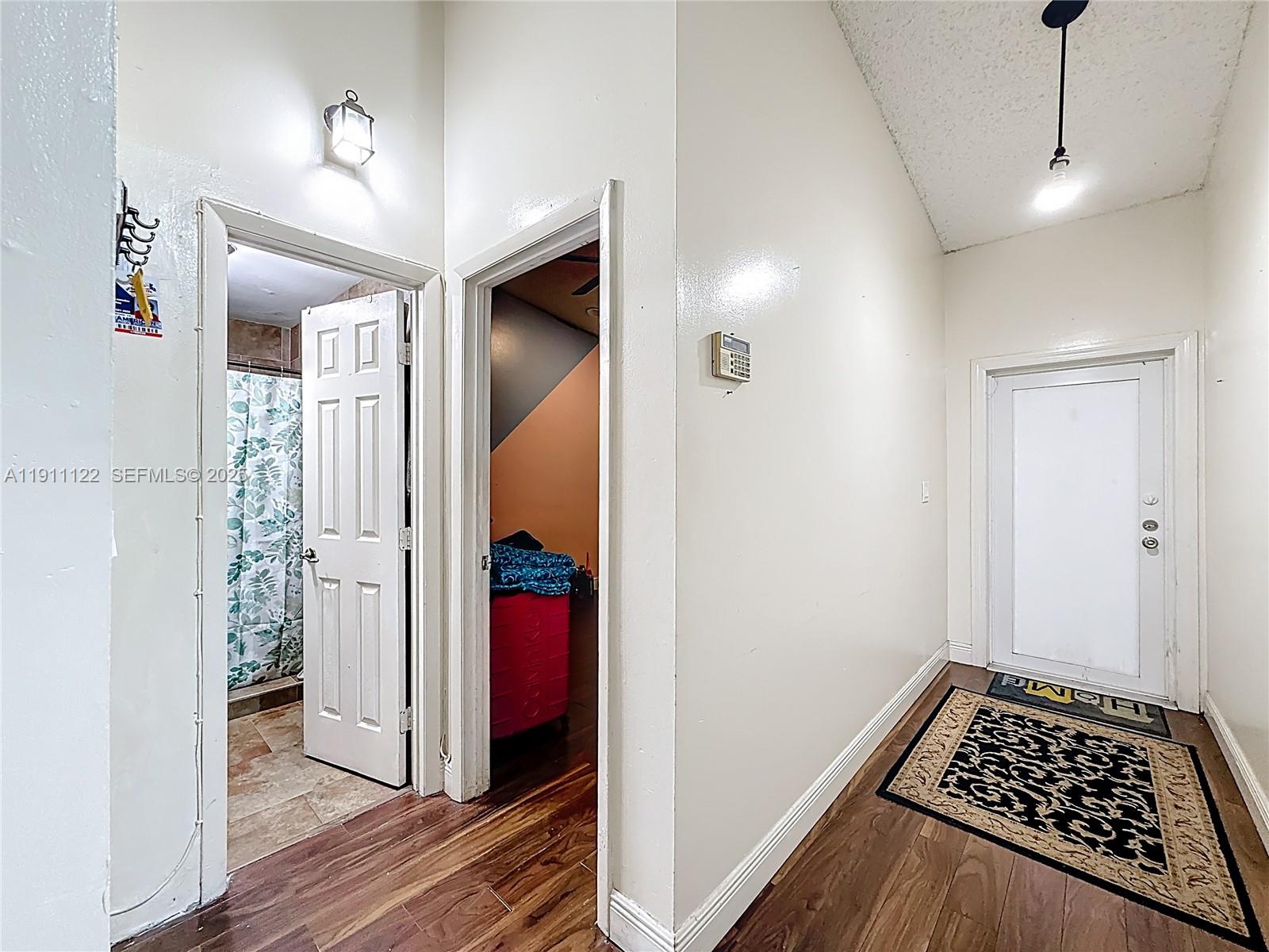 6722 Northwest 192nd Lane Hialeah, FL 33015 - Photo 12 of 46 a bathroom with a sink and a mirror