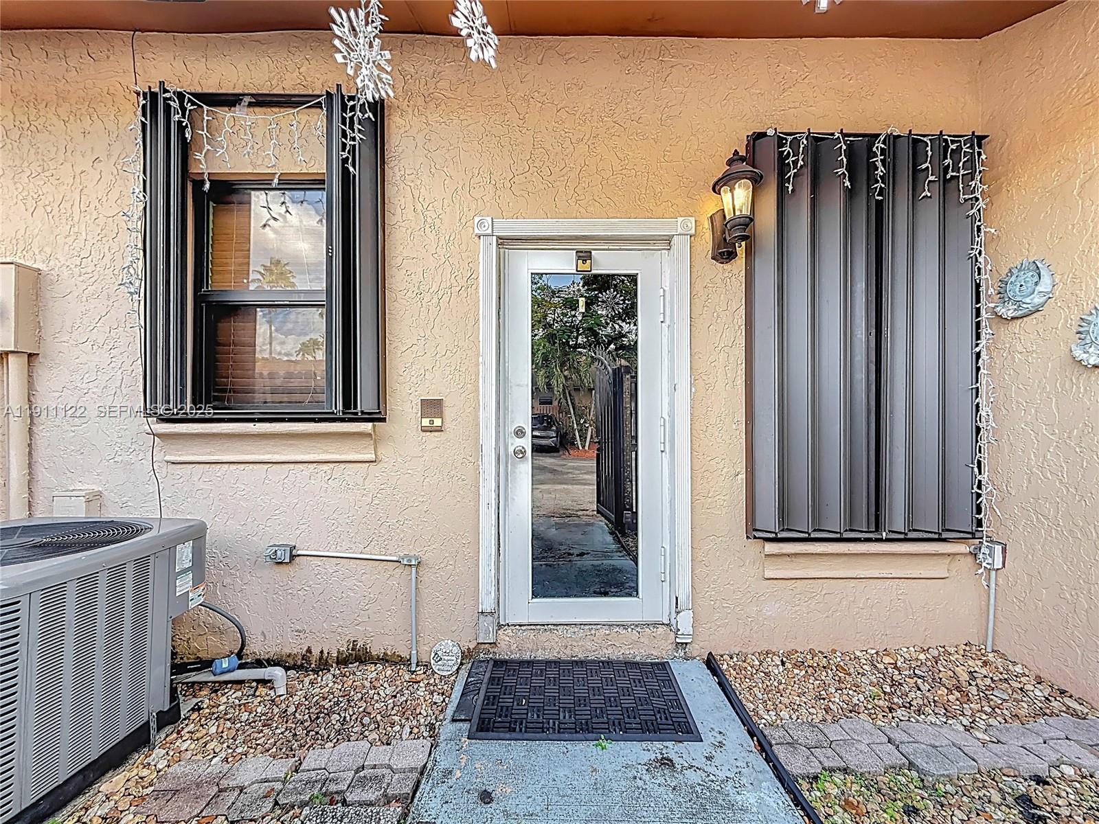 6722 Northwest 192nd Lane Hialeah, FL 33015 - Photo 13 of 46 a view of an entryway of a house
