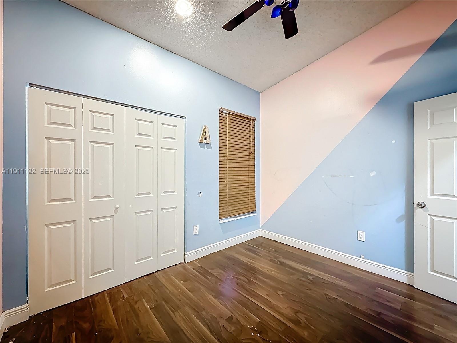 6722 Northwest 192nd Lane Hialeah, FL 33015 - Photo 28 of 46 wooden floor in an empty room