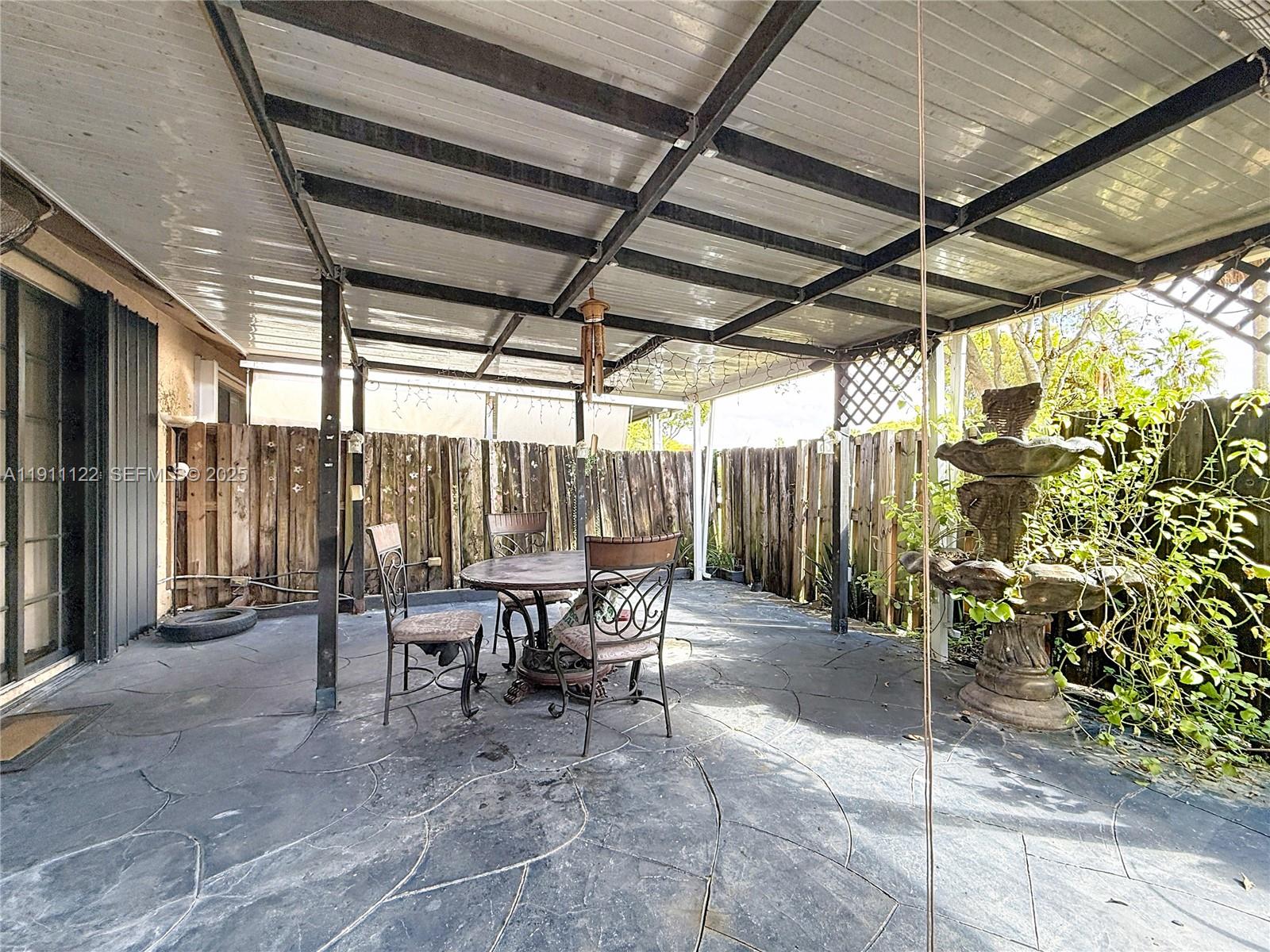 6722 Northwest 192nd Lane Hialeah, FL 33015 - Photo 34 of 46 a view of outdoor space with seating