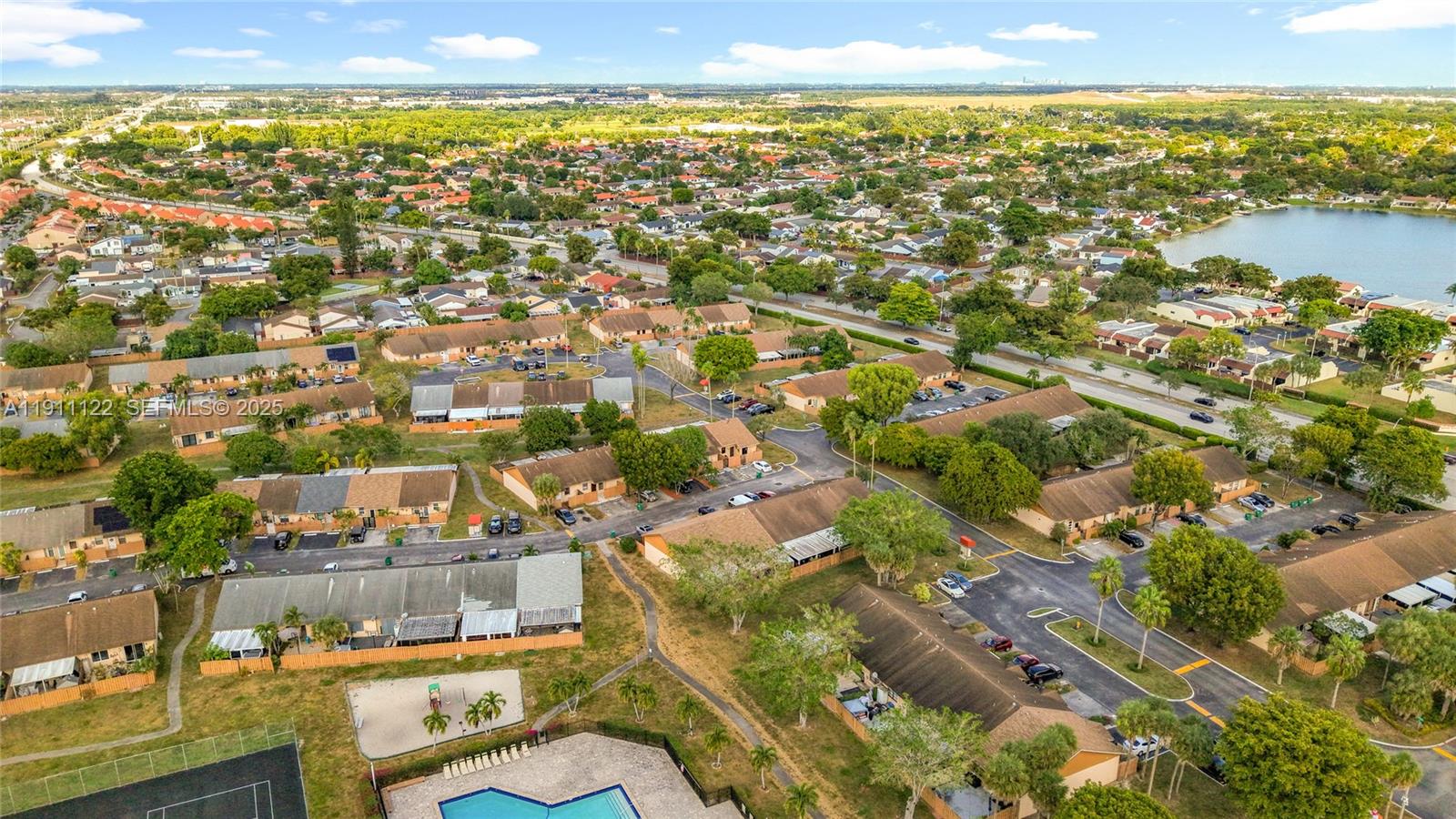 6722 Northwest 192nd Lane Hialeah, FL 33015 - Photo 39 of 46 an aerial view of residential building and lake