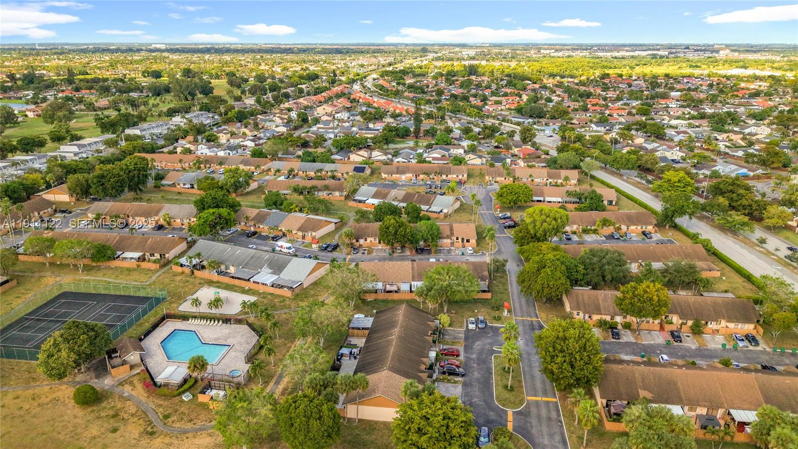6722 Northwest 192nd Lane Hialeah, FL 33015 - Photo 40 of 46 an aerial view of residential building and lake