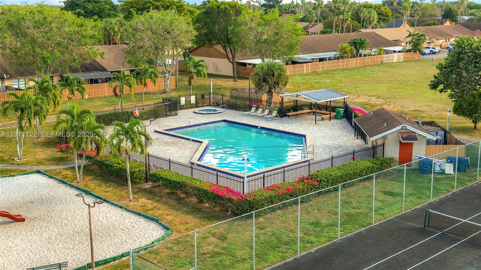 6722 Northwest 192nd Lane Hialeah, FL 33015 - Photo 43 of 46 an aerial view of residential houses with outdoor space and swimming pool