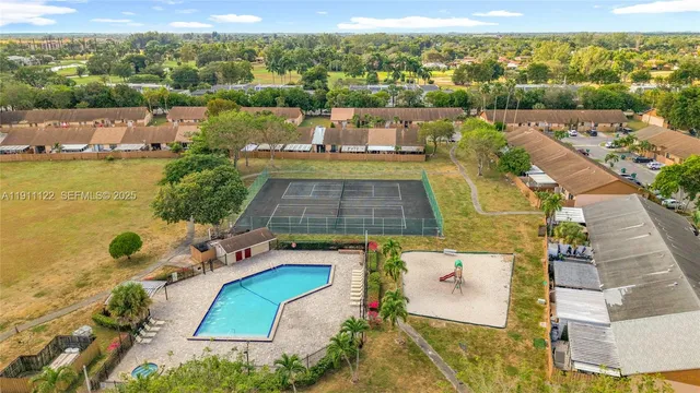 an aerial view of a house with a ocean view