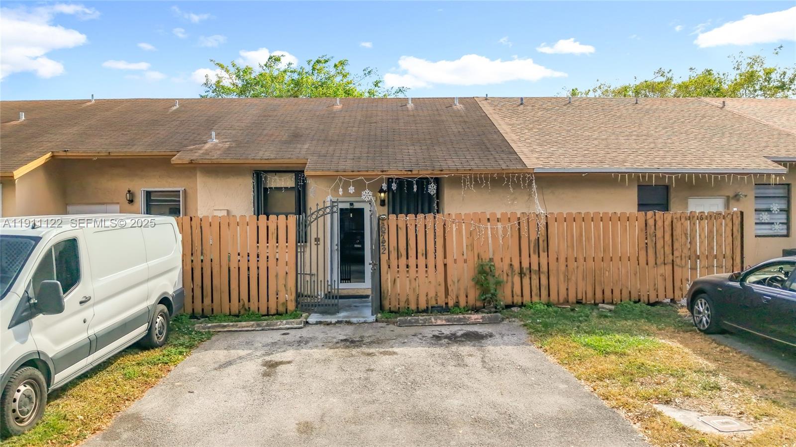 6722 Northwest 192nd Lane Hialeah, FL 33015 - Photo 6 of 46 a view of a house with a backyard