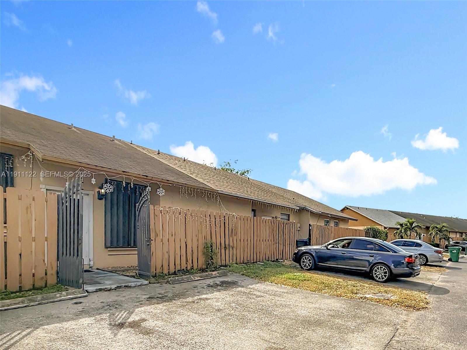 6722 Northwest 192nd Lane Hialeah, FL 33015 - Photo 9 of 46 a view of a car parked in front of a house