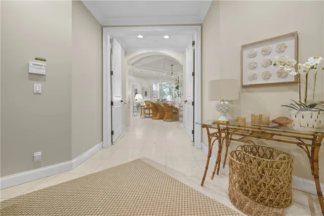 a view of a hallway with dining area