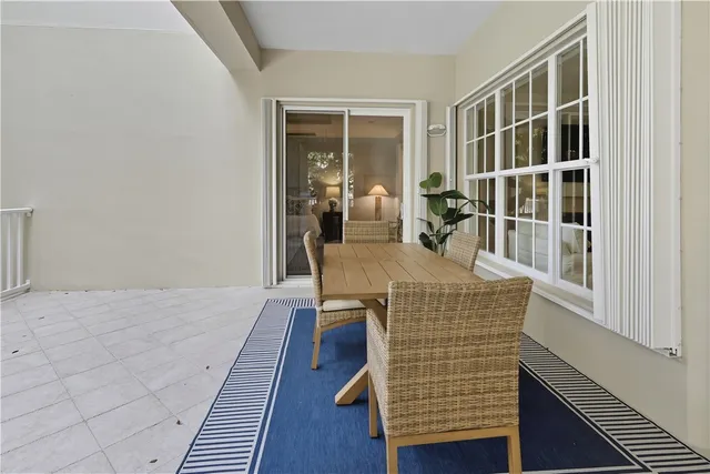 a view of living room with furniture and wooden floor